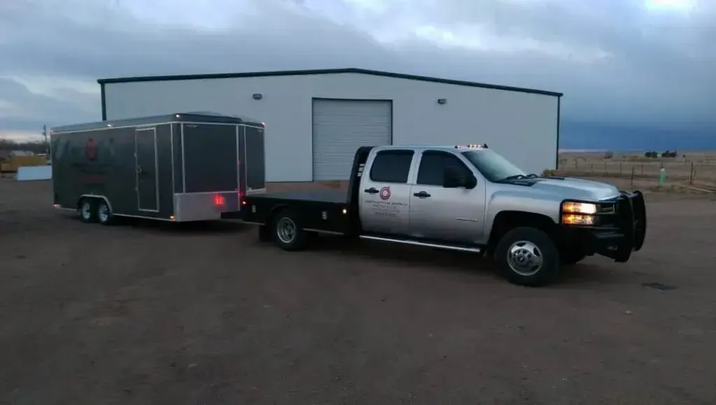 Truck And Trailer In Front Of Building